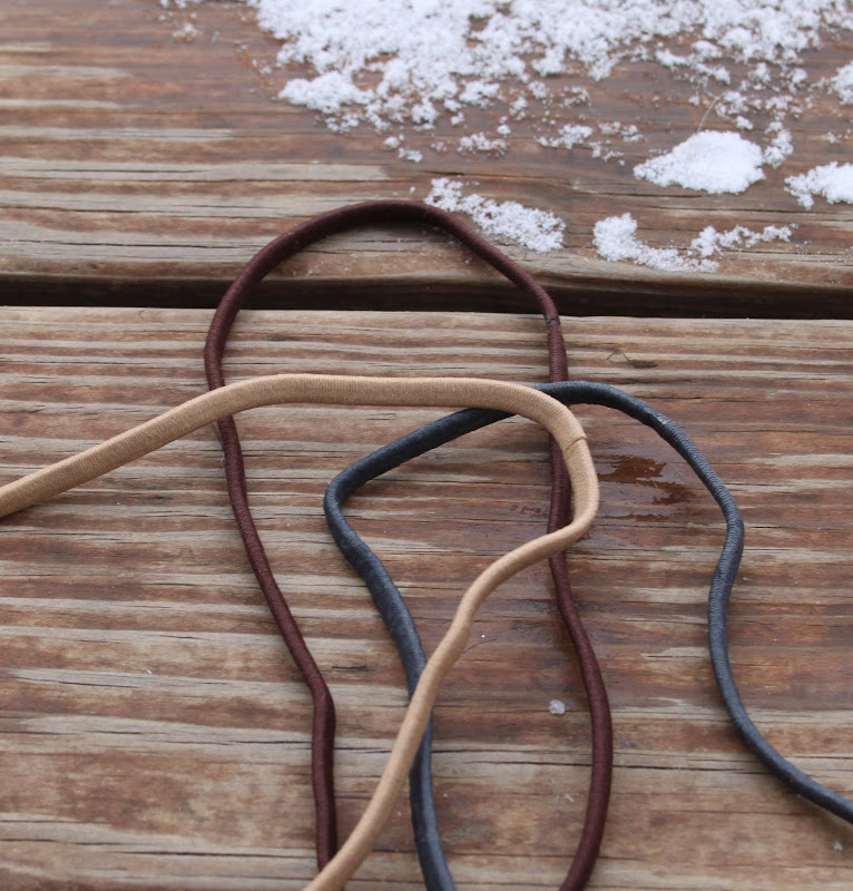 Super skinny elastic headbands in tan, brown, and gray. These fit title=