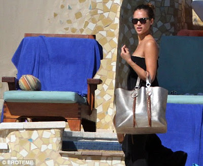 It's a good life: Jessica Alba relaxed at the pool yesterday while 