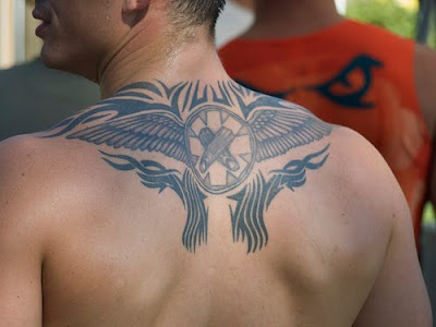 Upper back tattoos are hot! If you don't think so just imagine the wonderful 