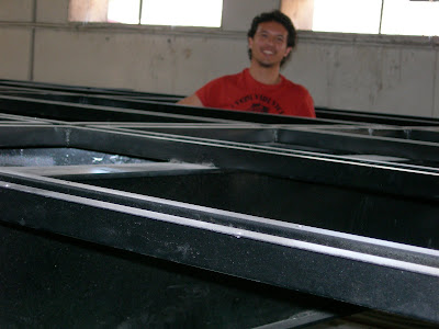 One of the decathletes inside the structure of the house