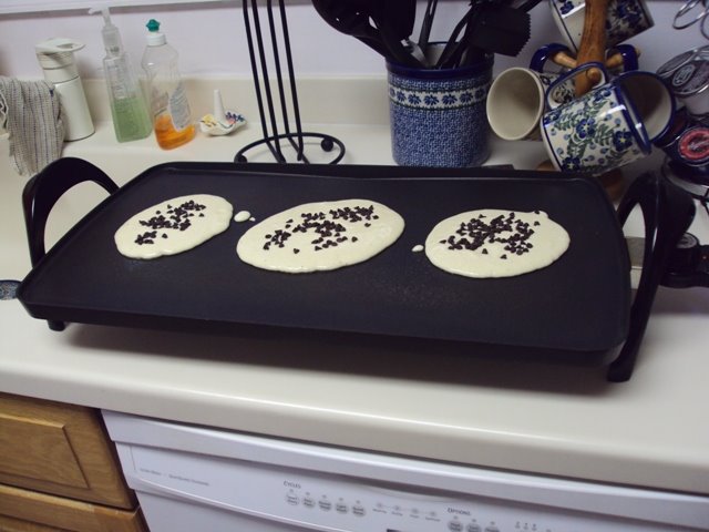 [Cooking+the+chocolate+pancakes.JPG]