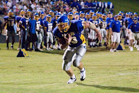 Connor McLaurin digging for the end zone