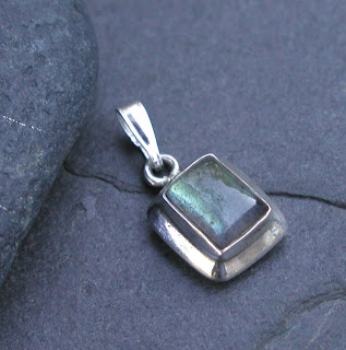 Beautiful labradorite with blue-green flash with a new bail