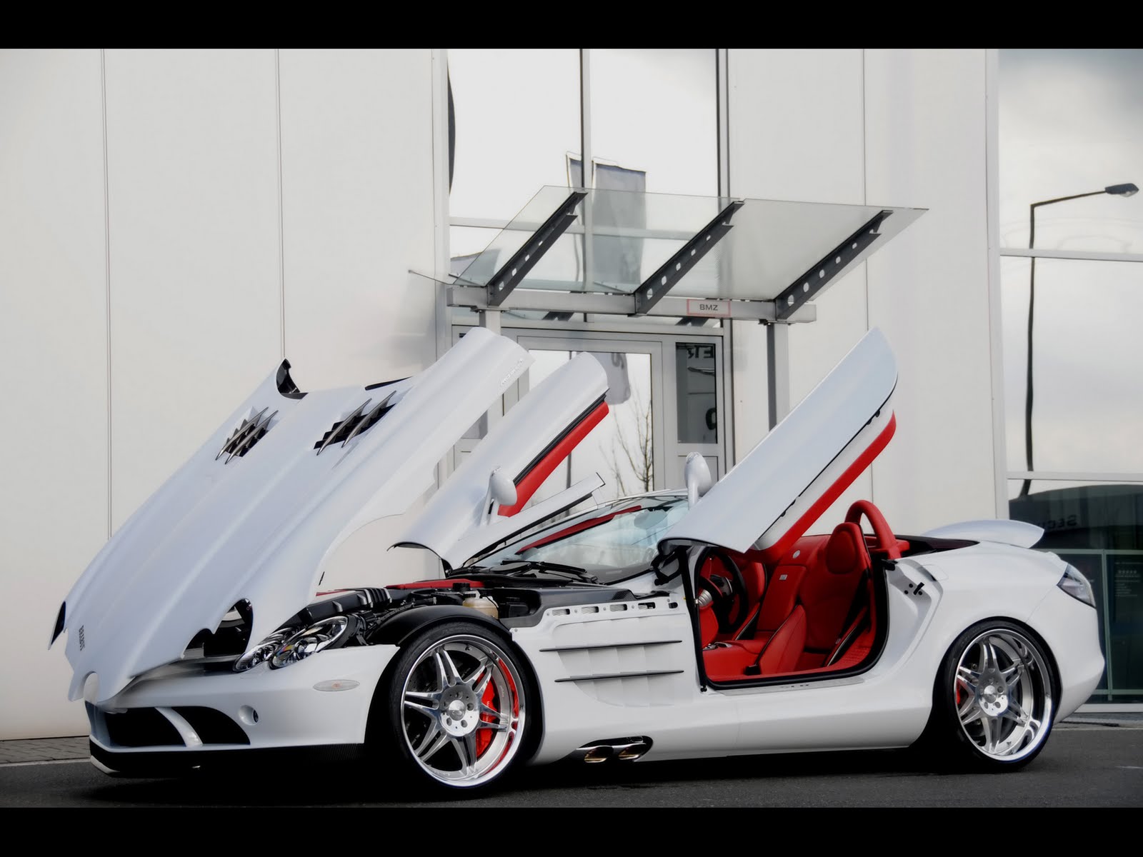 mercedes benz slr mclaren 2008-brabus-mercedes-benz-slr-mclaren-roadster-and-brabus-smart-ultimate-112-tender-package-slr-mclaren-side-angle-open-doors-and-hood-1920x1440