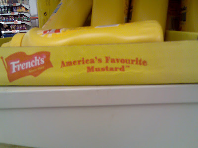 A box of French's mustard with the slogan 'America's favourite mustard' and the British English spelling of 'favourite'