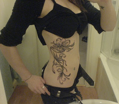 Sexy Lady with Flower Tattoo Design on Her Side Body