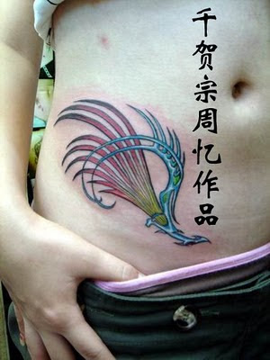 Phoenix Tattoo Design on Girl Abdomen