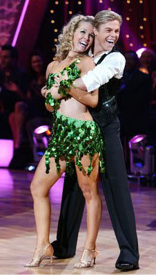 Thank goodness Derek is there to hold up Jennie Garth's sequined boa. Er, oh, is that her dress?