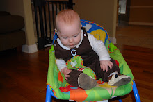 Sitting up on his own (escaping from the seat)