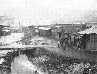 Photo of a street in Ouijongbu, 1960 by Bruce Richards