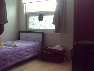 view of bed and window
