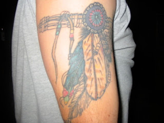 Native American Armband Tattoo with Feathers