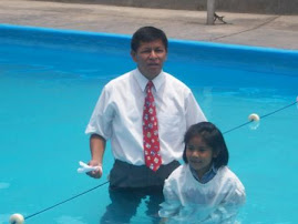 Pastor Evelio about to baptize his daughter, Yadi