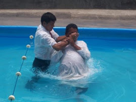 Pastor baptizing Orley's dad