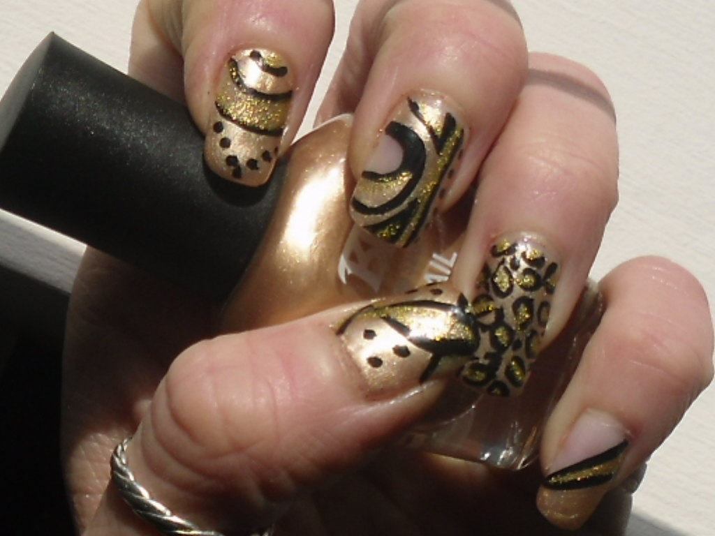 cute black and gold nail design
