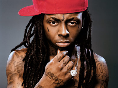 Can see Lil Wayne's neck tattoos including “East Side” and a big W and