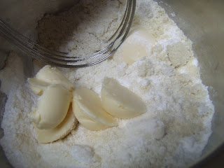 Paleo Buttermilk Biscuits #PaleoBiscuits #GlutenFreeBiscuits #GrainFreeBiscuits adding butter to dry ingredients