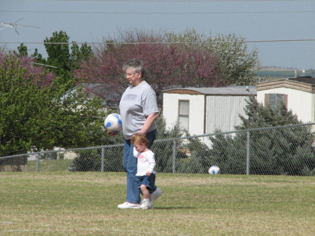 Kaydence and Nanny chasing the balls.