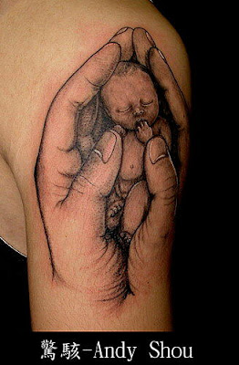 Baby in hands tattoo design