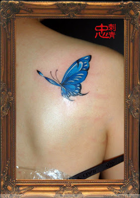 blue butterfly tattoo on the back