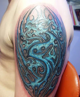 armor tattoo design on the upper arm