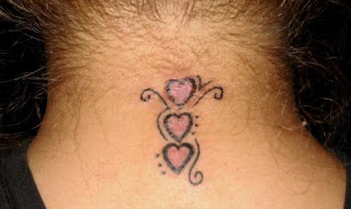 This is a nice little neck tattoo. A heart on top of a heart on top of a 