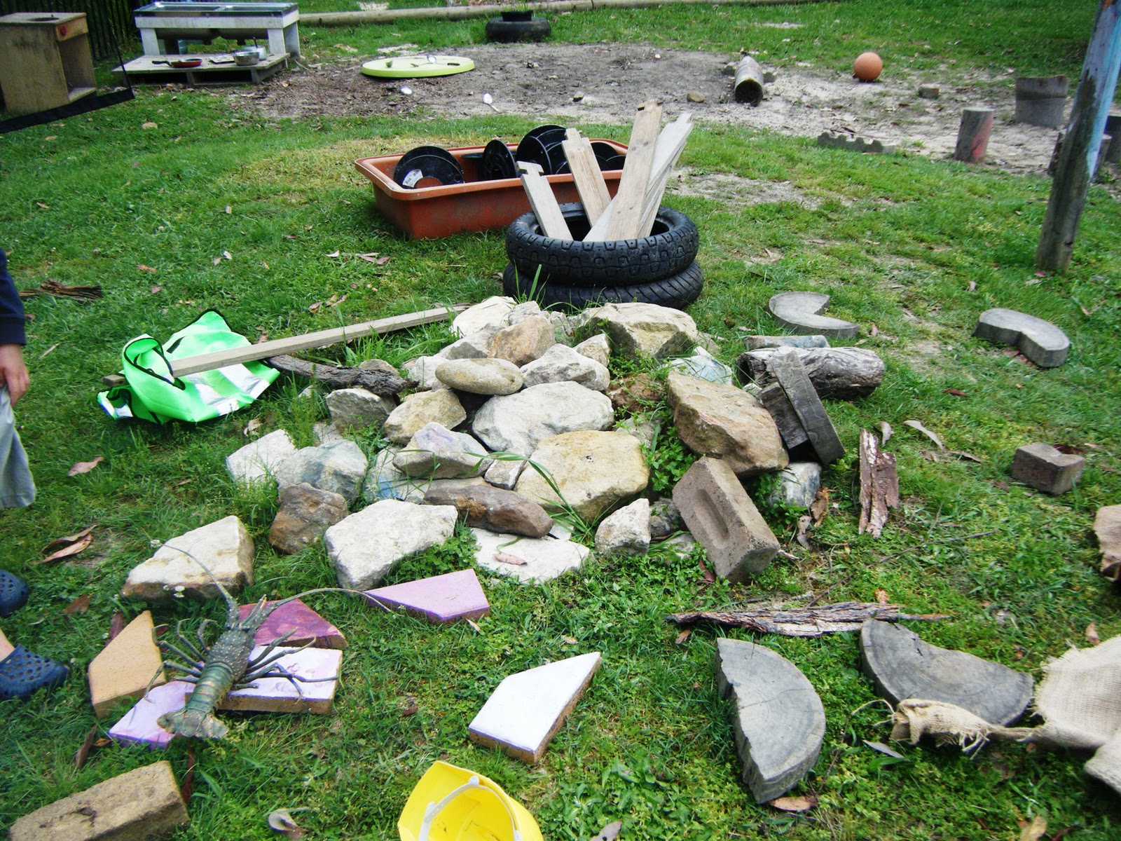 let the children play a preschool playground of "loose parts"