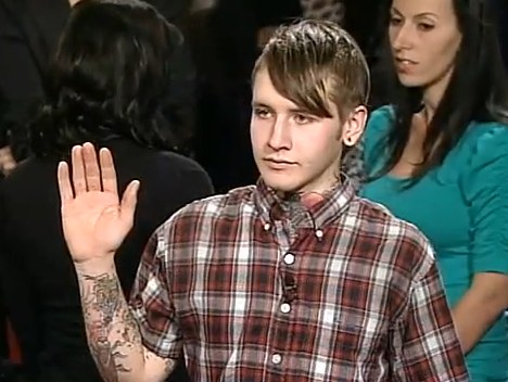 He's explaining to Judge Judy that his own hand tattoo is pending completion He's explaining to Judge Judy that his own hand tattoo is pending completion