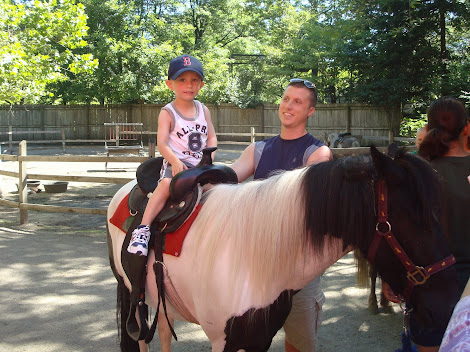 Coby riding oreo the pony