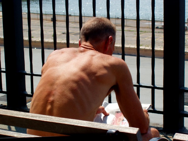 [Man+reading+paper.JPG]