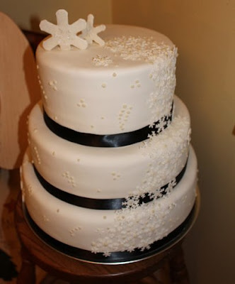 Snowflake wedding cake with black ribbon Snowflake wedding cake with black ribbon
