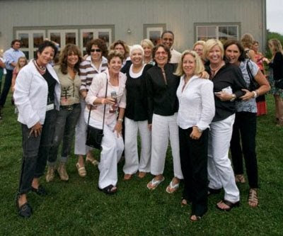 Event founder Lizz Salaway (in black wiht glasses) celebrates the night with friends.