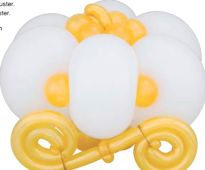 Let 39s not forget the table centerpieces like this balloon pumpkin carriage
