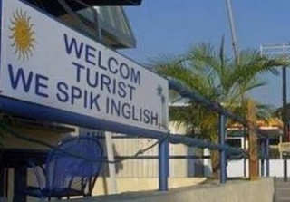 welcom turist we spik inglish sign