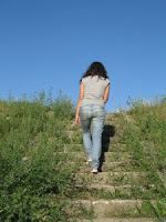 woman walking up a hill