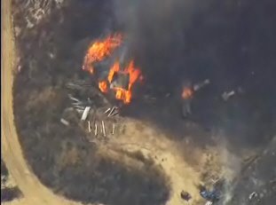 [LittleT_fire_structure_burning.jpg]