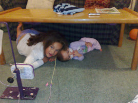 2 girls under the table, tubes and all!!