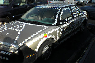car covered in apple computer stickers