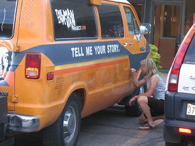 Participant writing her recession story on the van Participant writing her recession story on the van