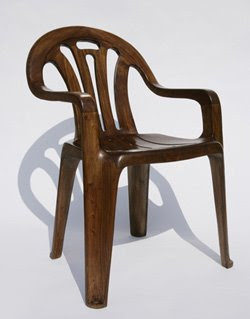 Chair becomes plastic lawn