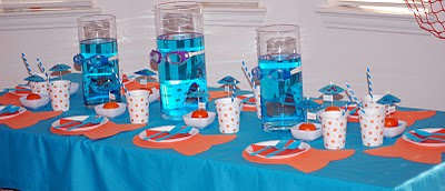 Orange and turquoise create a splash of color to this Under The Sea Party Kids Birthday Party! Including cute dessert table, place cards and party favors!