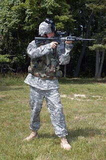 A soldier discharging his weapon.
