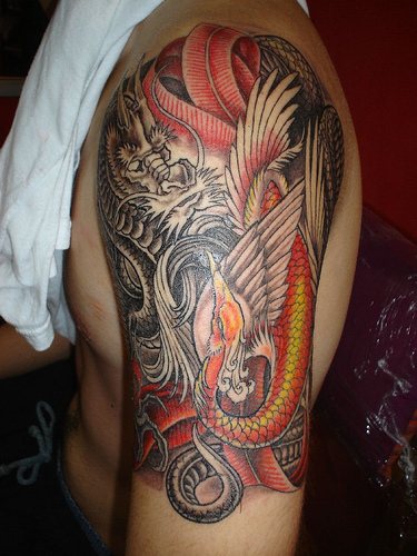 Just added! Dragon tattoo on arm.