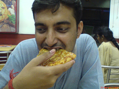 Sayak Roy Choudury eating pizza