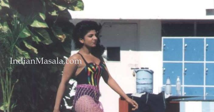 bollywoodnavelshow Rambha in swimsuit near pool