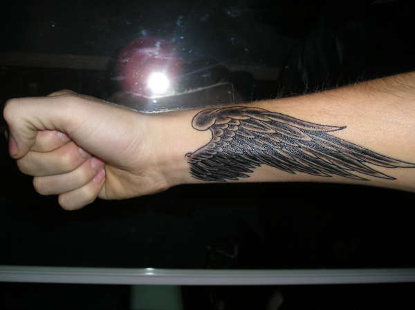 Labels wings wrist tattoos
