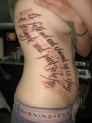 Lettering Ribs tattoo