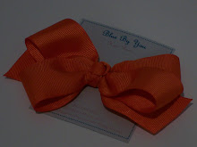 4" bow made with 1 1/2" orange grosgrain ribbon
