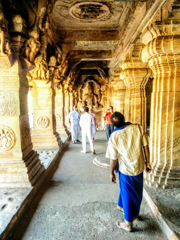 Admiring the glorious work inside the cave temples of Badami, Karnataka