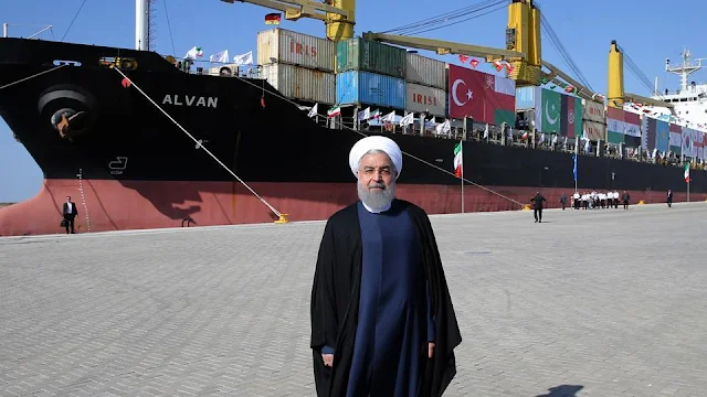 Image Attribute: A handout picture provided by the office of Iranian President Hassan Rouhani on December 3, 2017, shows him inaugurating the first phase of Chabahar Port / Source: IRNA
